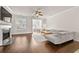 Bright living room with hardwood floors, fireplace, neutral tones, and an open layout at 3022 Hartford Mill, Duluth, GA 30097