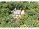 Stunning aerial view of a home nestled among lush greenery with a sprawling driveway at 4720 Timberland Sw Dr, Mableton, GA 30126