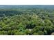 Aerial view showing home nestled in a wooded area at 4720 Timberland Sw Dr, Mableton, GA 30126