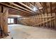 Unfinished attic space with exposed wooden beams and rafters, showcasing potential for customization at 4720 Timberland Sw Dr, Mableton, GA 30126