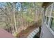A view of the backyard from the deck with stone stairs at 4720 Timberland Sw Dr, Mableton, GA 30126