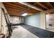 Unfinished basement space ready for customization, featuring insulation and rubber flooring at 4720 Timberland Sw Dr, Mableton, GA 30126