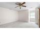 Neutral bedroom with ceiling fan, carpeted floors and window offering natural light at 4720 Timberland Sw Dr, Mableton, GA 30126
