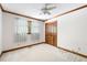 Cozy bedroom features carpet flooring, wooden trim, a ceiling fan, and a closet at 4720 Timberland Sw Dr, Mableton, GA 30126