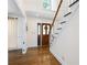 Inviting foyer with hardwood floors, decorative front door and staircase at 4720 Timberland Sw Dr, Mableton, GA 30126