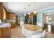 Kitchen with island, tile floor, stainless steel refrigerator, and breakfast bar at 4720 Timberland Sw Dr, Mableton, GA 30126