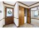 Mud room entryway with wood door, tile floor, and storage space at 4720 Timberland Sw Dr, Mableton, GA 30126