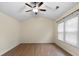 Bedroom featuring vaulted ceiling, ample natural light and hard wood flooring at 522 Bass Nw Pointe, Kennesaw, GA 30144