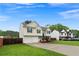 Attractive home with a spacious driveway leading to a two-car garage, complemented by a neatly maintained lawn at 522 Bass Nw Pointe, Kennesaw, GA 30144