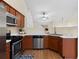 Well-equipped kitchen with stainless steel appliances, wood cabinets, and an open layout at 522 Bass Nw Pointe, Kennesaw, GA 30144