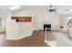 Open living space with fireplace, high ceilings, and adjacent kitchen at 522 Bass Nw Pointe, Kennesaw, GA 30144