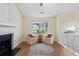Bright living room showcasing hardwood floors, a fireplace, vaulted ceilings, and cozy seating area with natural light at 522 Bass Nw Pointe, Kennesaw, GA 30144