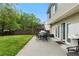 Back patio featuring outdoor dining, grill, and green space at 522 Bass Nw Pointe, Kennesaw, GA 30144