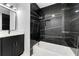 Modern bathroom with black marble accent wall, white fixtures, and a sleek vanity at 801 Arbor Hill Dr, Stone Mountain, GA 30088