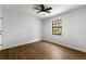 Bright bedroom with a ceiling fan, natural light and wood-look laminate flooring at 801 Arbor Hill Dr, Stone Mountain, GA 30088