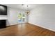 Bright dining room with modern chandelier and patio doors leading to the deck at 801 Arbor Hill Dr, Stone Mountain, GA 30088