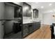 Kitchen features black stainless steel appliances, dark cabinets, and white countertops at 801 Arbor Hill Dr, Stone Mountain, GA 30088
