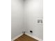 Empty laundry room with laminate wood floors at 801 Arbor Hill Dr, Stone Mountain, GA 30088