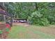 A well-maintained backyard features storage structures, offering ample space and functionality at 962 Cove Lake Ct, Lawrenceville, GA 30045