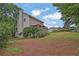 The backyard has a well-maintained lawn and covered deck that provide an inviting outdoor space at 962 Cove Lake Ct, Lawrenceville, GA 30045