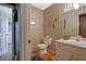 Traditional-style bathroom featuring a toilet, sink, and linen closet, offering a simple and functional space at 962 Cove Lake Ct, Lawrenceville, GA 30045