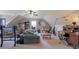 Spacious bonus room with desk, sofa, weight training area, and lots of light at 962 Cove Lake Ct, Lawrenceville, GA 30045