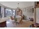 Bright dining room with large windows, decorative wallpaper, and a chandelier at 962 Cove Lake Ct, Lawrenceville, GA 30045