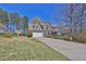 Beautiful home with a well-manicured lawn and a two-car garage at 962 Cove Lake Ct, Lawrenceville, GA 30045