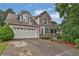 Inviting home with stone accents, attached garage, and well-maintained landscaping at 962 Cove Lake Ct, Lawrenceville, GA 30045