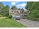 Charming two-story home with stone accents, covered car, well-manicured lawn, and inviting curb appeal at 962 Cove Lake Ct, Lawrenceville, GA 30045