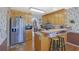 Charming kitchen with wooden cabinets, stainless steel appliances, and a cozy breakfast bar with seating at 962 Cove Lake Ct, Lawrenceville, GA 30045