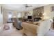 Cozy living room features a stone fireplace, comfortable seating, and a ceiling fan at 962 Cove Lake Ct, Lawrenceville, GA 30045