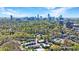 Desirable neighborhood featuring lovely townhomes, verdant trees, and a picturesque skyline backdrop at 13 Ivy Ne Sq, Atlanta, GA 30342
