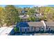 Aerial view of well-maintained townhomes with mature landscaping and plenty of parking at 13 Ivy Ne Sq, Atlanta, GA 30342