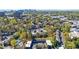 Charming townhome community nestled among mature trees, with stunning views of the city skyline at 13 Ivy Ne Sq, Atlanta, GA 30342
