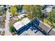 Overhead view of the apartments with parking, a tennis court, and a pool at 13 Ivy Ne Sq, Atlanta, GA 30342