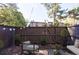 Private backyard patio with charming string lights and mature trees at 13 Ivy Ne Sq, Atlanta, GA 30342
