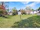 Exterior view of large grassy backyard, mature trees, and landscaping at 13 Ivy Ne Sq, Atlanta, GA 30342