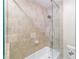 Close-up of the shower showcasing the tiled wall, glass screen and shower head at 13 Ivy Ne Sq, Atlanta, GA 30342