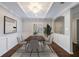 Bright dining room with modern decor, including a stylish light fixture and large window at 13 Ivy Ne Sq, Atlanta, GA 30342