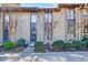 Street view of the townhome community with well-maintained landscaping at 13 Ivy Ne Sq, Atlanta, GA 30342