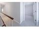 Second-floor hallway with carpet flooring, leading into a bedroom at 13 Ivy Ne Sq, Atlanta, GA 30342