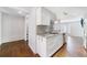 Well-lit kitchen with stainless steel appliances and a view into a second living area at 13 Ivy Ne Sq, Atlanta, GA 30342