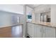 Open-concept kitchen with granite countertops and stainless steel refrigerator at 13 Ivy Ne Sq, Atlanta, GA 30342