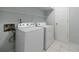 Laundry room featuring a washer, dryer and tiled floors at 13 Ivy Ne Sq, Atlanta, GA 30342