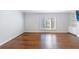 Spacious living room features hardwood floors, bright windows, and built-in shelving at 13 Ivy Ne Sq, Atlanta, GA 30342