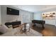 Cozy living space featuring a foosball table, bar area, and access to outdoor space through French doors at 13 Ivy Ne Sq, Atlanta, GA 30342