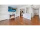 Cozy living room with fireplace and built-in bookshelves with beautiful hardwood floors at 13 Ivy Ne Sq, Atlanta, GA 30342