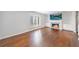 Bright living room with a modern fireplace and built-in shelving, complemented by gleaming hardwood floors at 13 Ivy Ne Sq, Atlanta, GA 30342