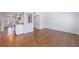 Open concept living room flows seamlessly into kitchen area with dark hardwood floors throughout at 13 Ivy Ne Sq, Atlanta, GA 30342